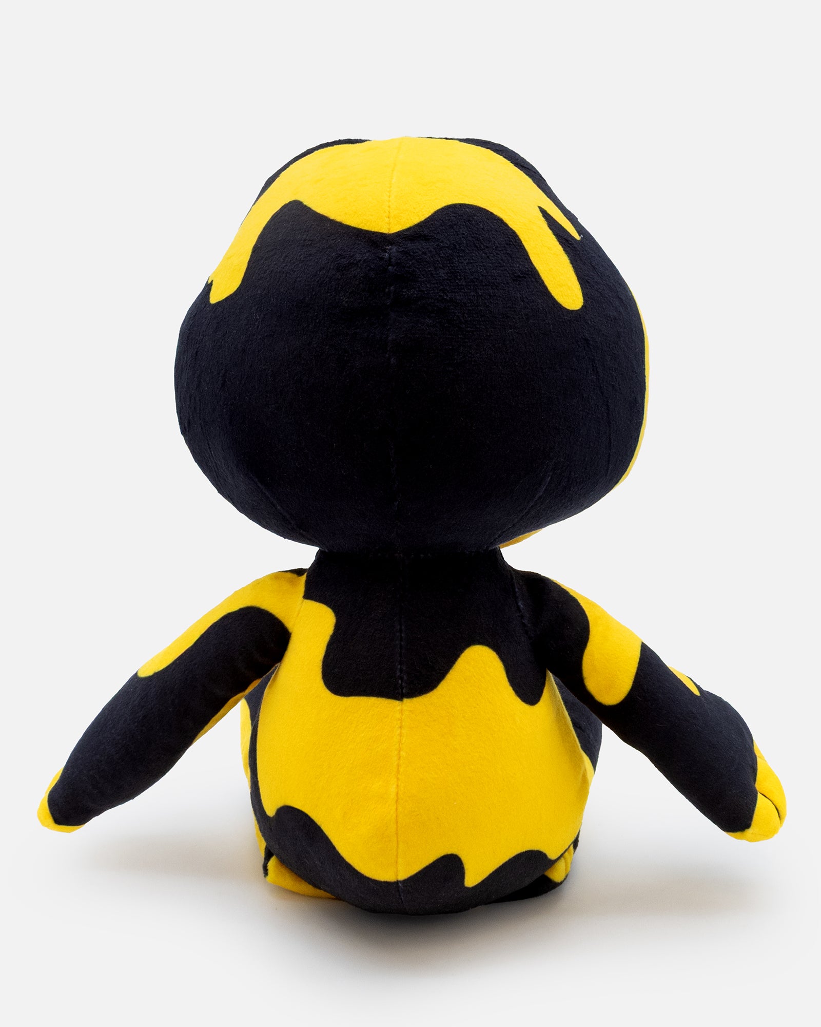 Black and yellow plush toy on a white background