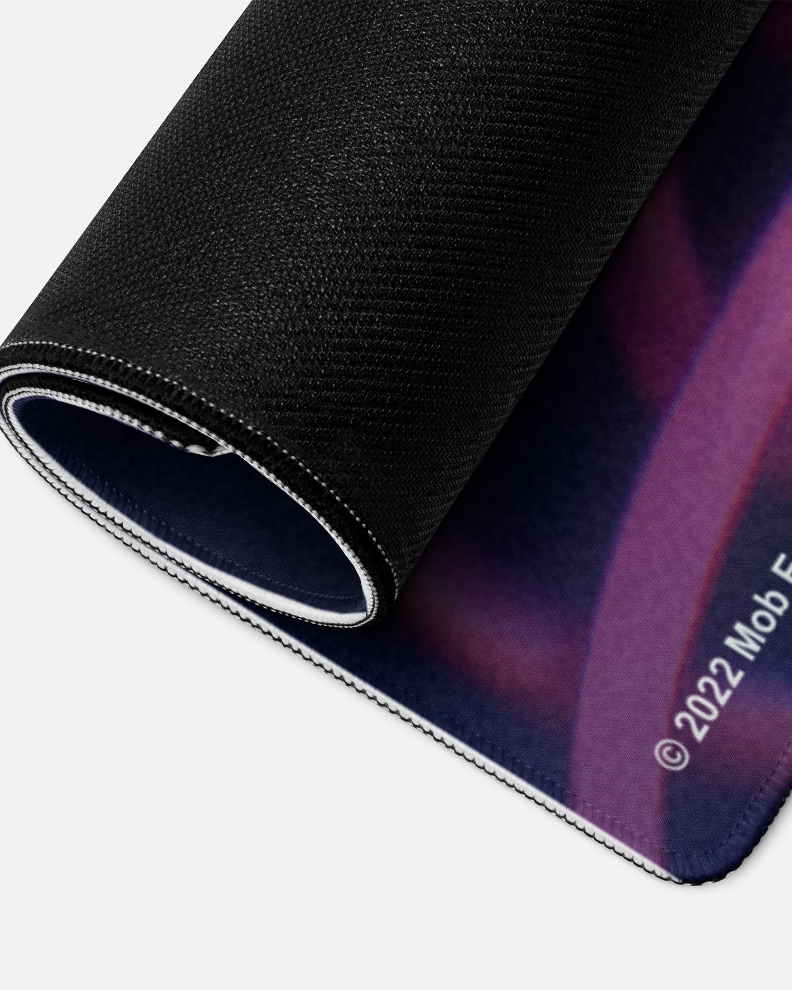 mommy longlegs puppeted gamer mousepad rolled up to show bottom material.