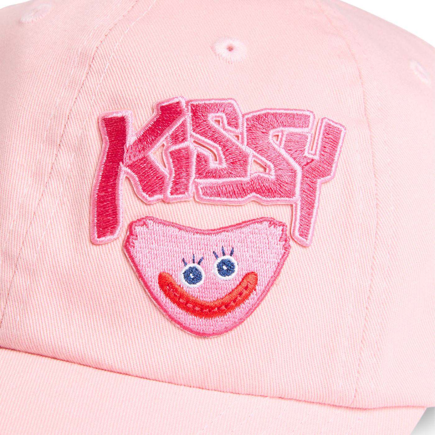 close up shot of embroidered Kissy text and smiling kissy missy face.