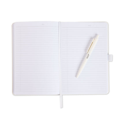 An open white notebook with a white pen resting diagonally across the pages.