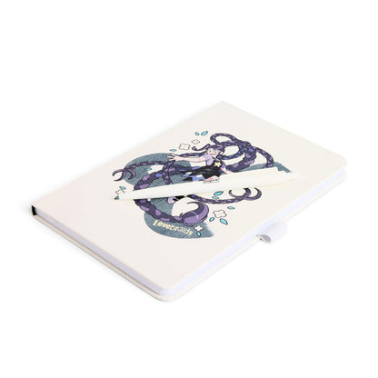 A white journal featuring a detailed illustration of Lily Lovebraids with purple hairand the word 'Lovebraids' on the cover, shown with a white pen.
