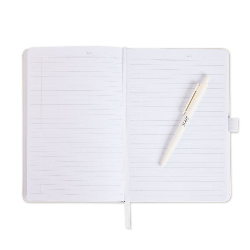 An open journal with white pages and a matching white pen resting on the right page.