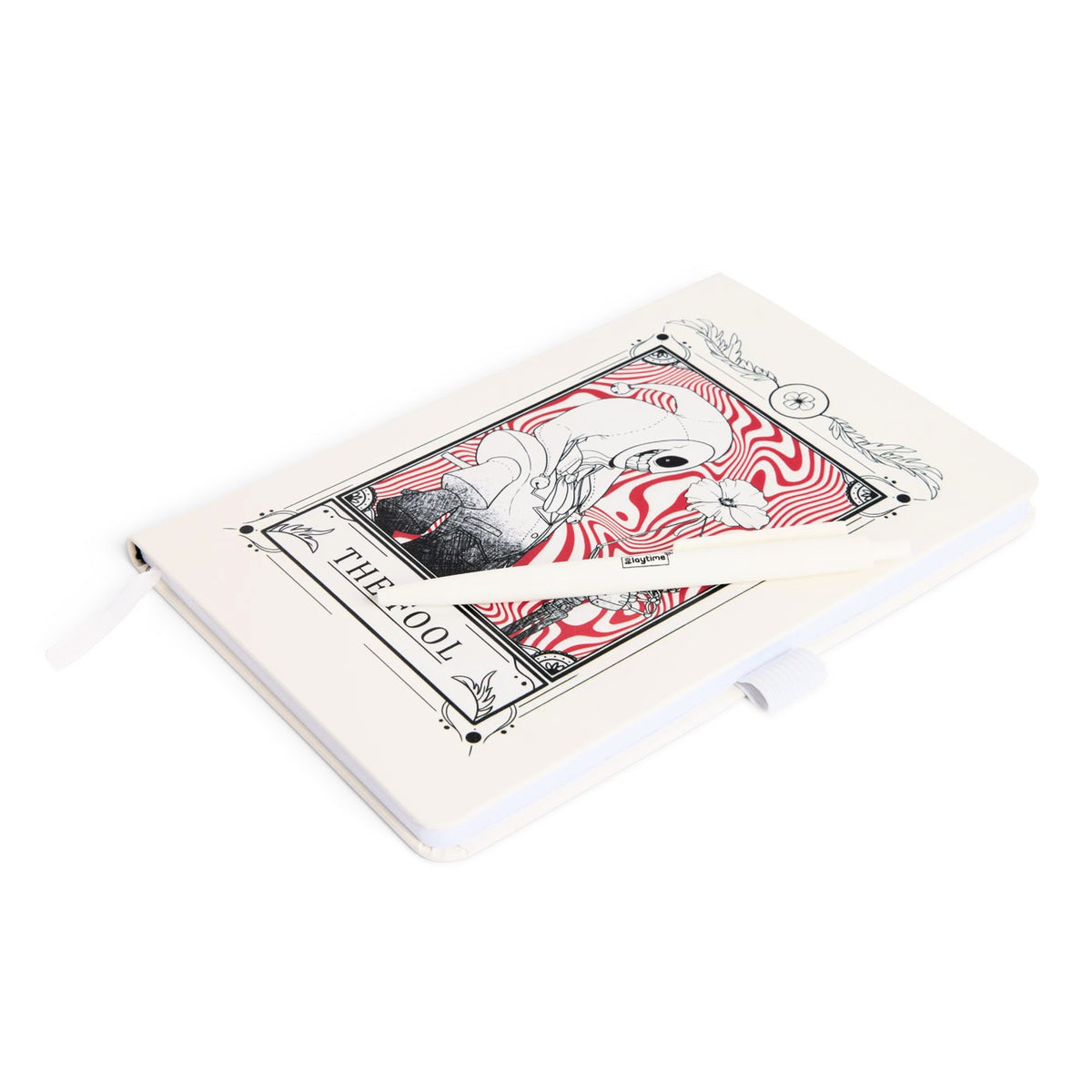 A white cover journal featuring a vintage-style tarot card illustration labeled 'THE FOOL!' with red and black artwork, with a white pen resting across the cover.