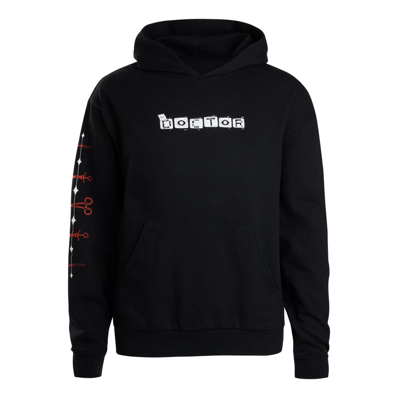 A black pullover hoodie featuring 'THE DOCTOR' printed in white block letters across the chest, with white and red Surgical instruments graphics down the left sleeve.