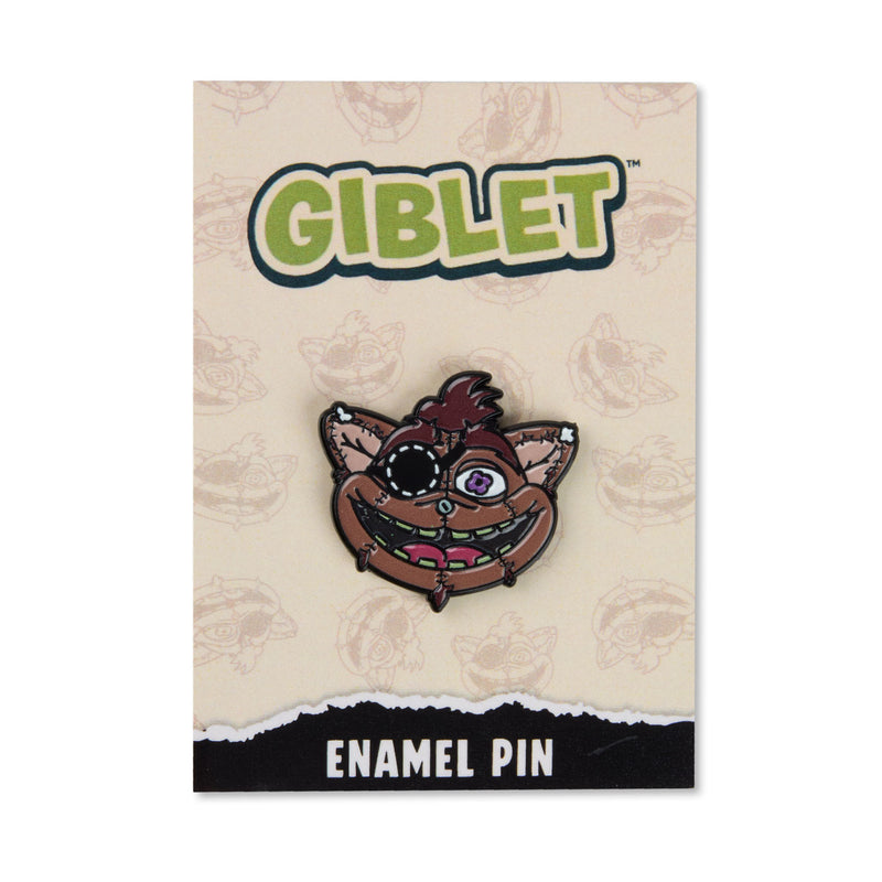 A GIBLET brand enamel pin of a cartoonish brown face with one patched eye, displayed on its beige backing card with 'GIBLET' branding and 'ENAMEL PIN' text.