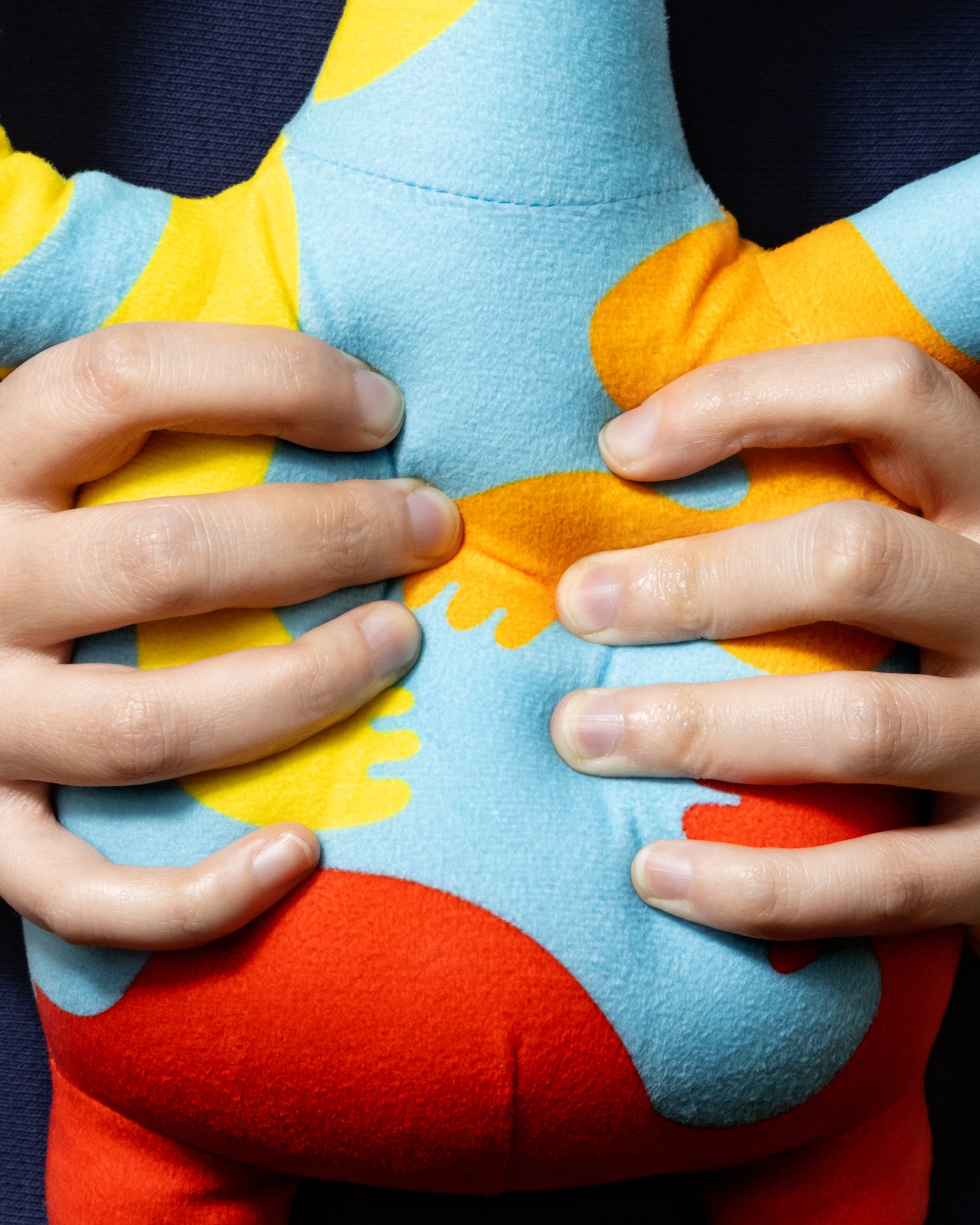 doey the doughman plush body squish. hands squishing foam body.