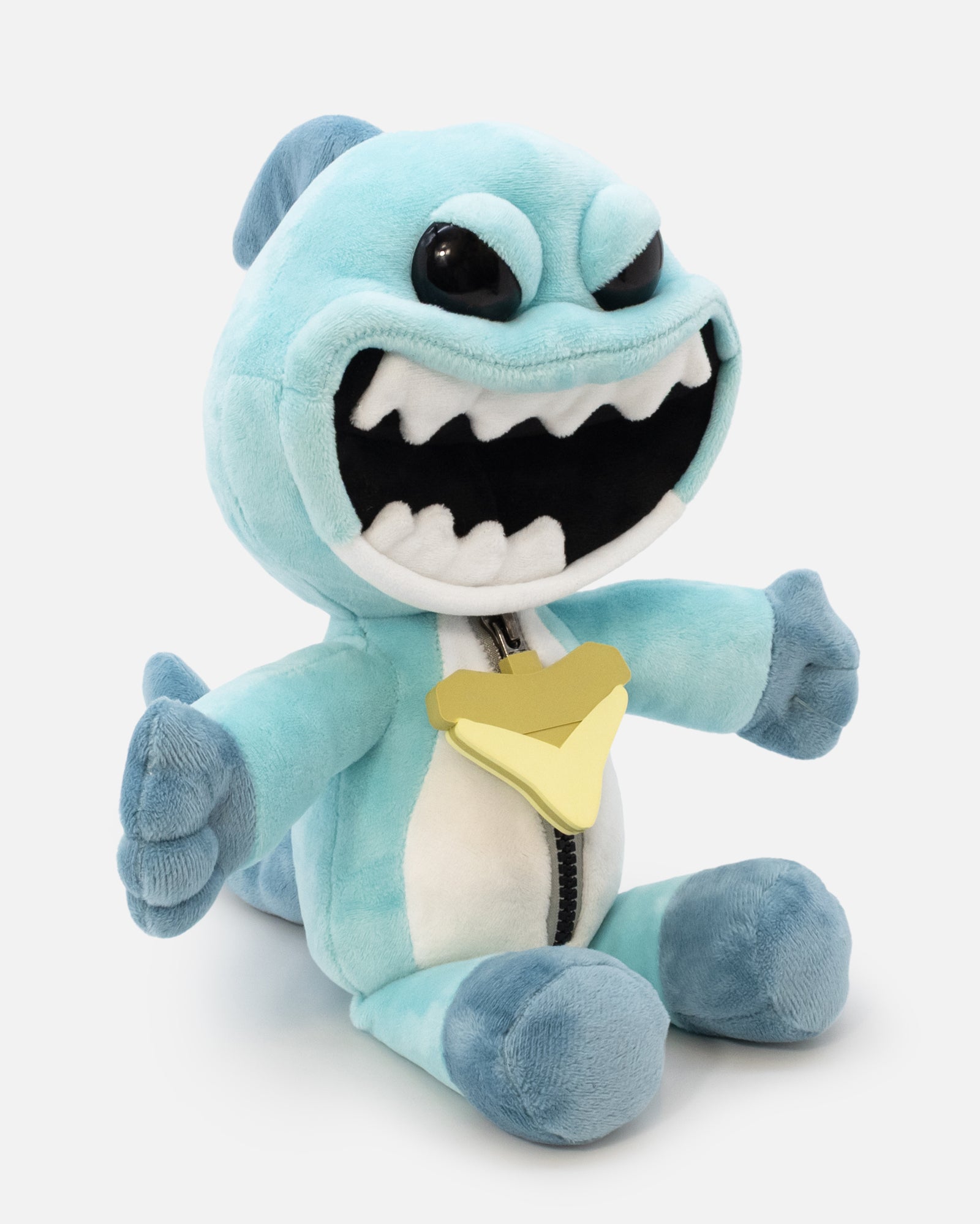Blue plush toy with a shark design on a white background