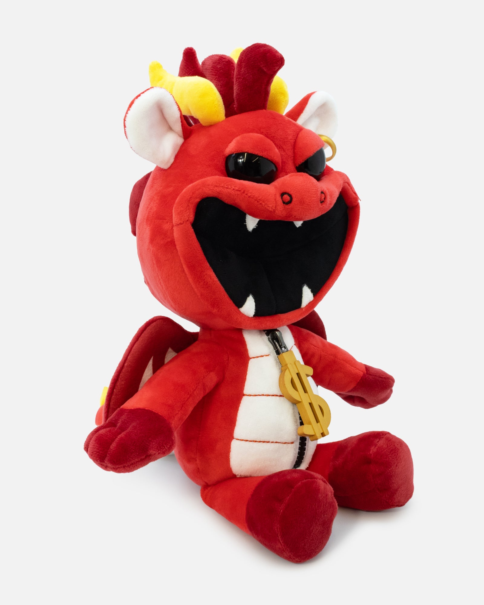 Red plush toy with a angry expression on a white background