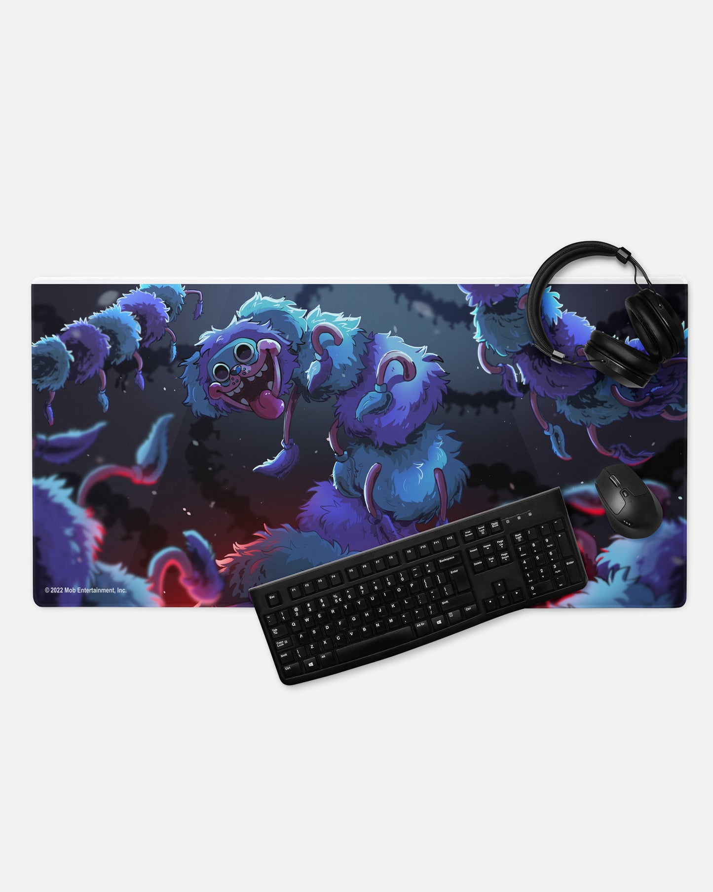 pj pugapillar gamer mousepad with headphones, keyboard, and mouse to show example of gaming set up. image: long body pj pugapillar with body taking up all of image